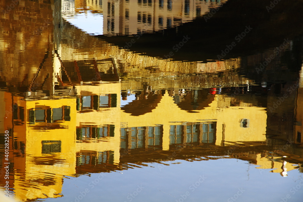 reflection of Ponte Vecchio on Arno river , Florence