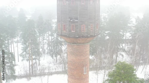 view of the old water tower standing by the road