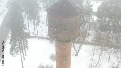 view of the old water tower standing by the road