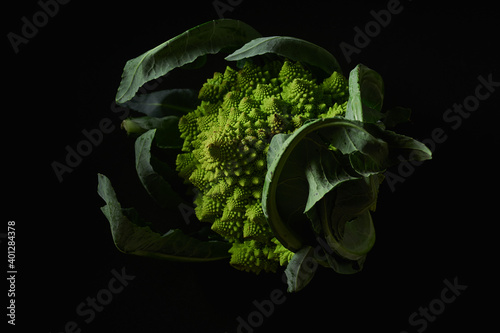 Closeup of romanesco broccoli cabbage on black background photo