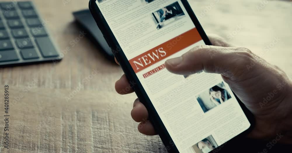 Reading news on mobile phone