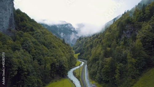 Beautiful river and road in the foggy valley of Lauterbrunnen in the morning. Beautiful Switzerland.