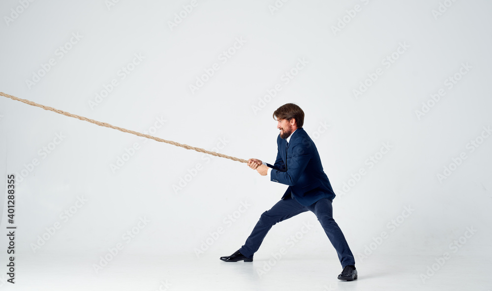 man with rope in hand on light background business finance advertising model man with rope in hand on light background business finance advertising model