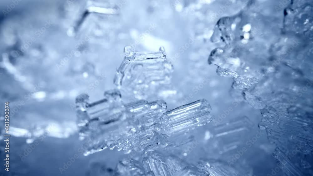 Camera moves through the snow crystals. Transparent snow ice formations background. Real snow frost figures. Winter nature sliding shot. High quality, UHD
