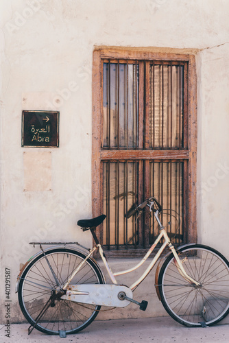 Bicycle parked by the wall with abra sign © sashapritchard