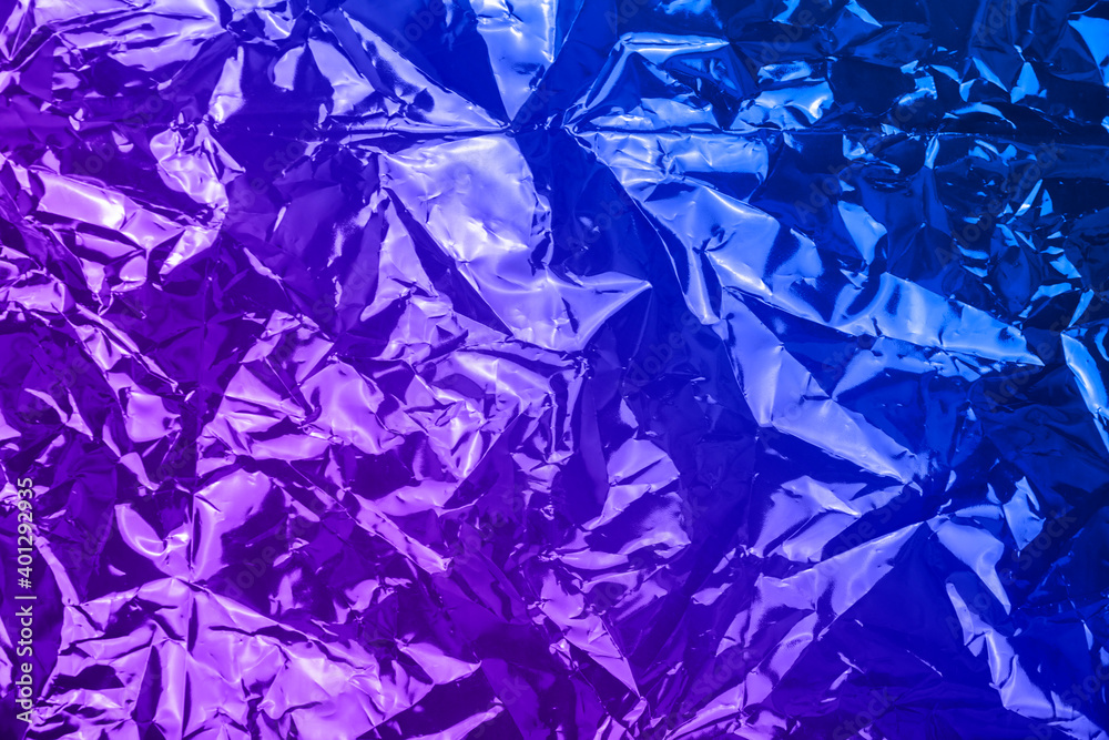 Obraz premium Neon crumpled textured holographic background. High quality photo