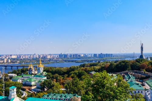 View of Kiev Pechersk Lavra (Kiev Monastery of the Caves), Motherland Monument and the Dnieper river in Ukraine. View from Great Lavra Bell Tower