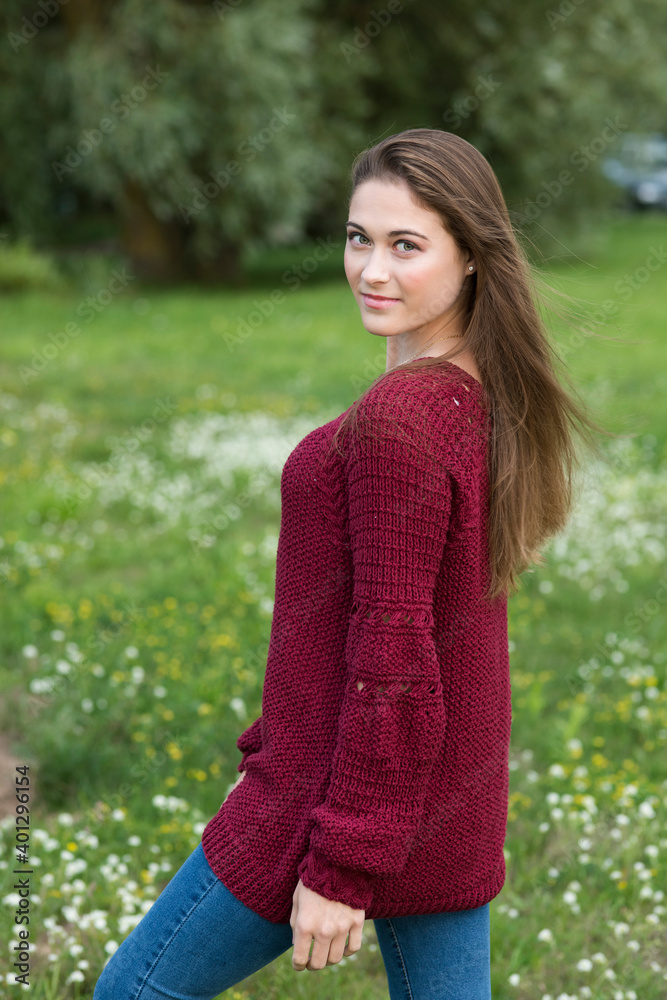 Portrait of a young woman in a burgundy handmade sweater
Portrait of a young woman in a burgundy handmade sweater