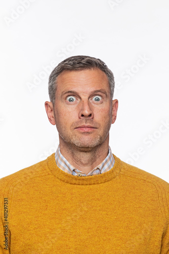 middle aged caucasion male surprised or shocked about the outcome of an event or decision