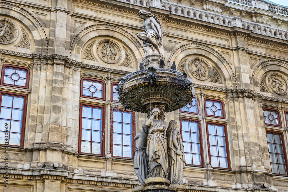 Details of marble water fountain (1869) near Vienna Opera house (Staatsoper). Karajan-Platz, Vienna, Austria.