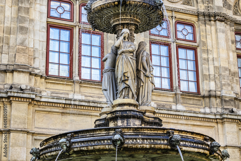 Details of marble water fountain (1869) near Vienna Opera house (Staatsoper). Karajan-Platz, Vienna, Austria.