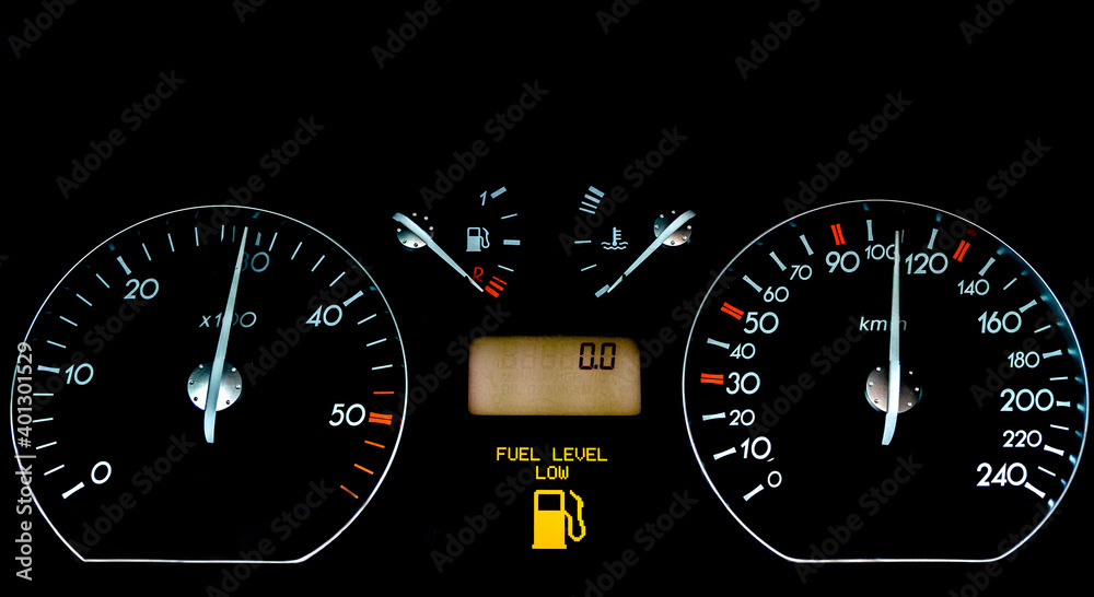 Fototapeta premium Car dashboard on a black surface. Car instrumental panel with warning signs and warnings. Car speedometer