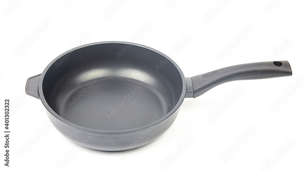 Black frying pan with non-stick teflon coating on white background Black frying pan with non-stick teflon coating on white background