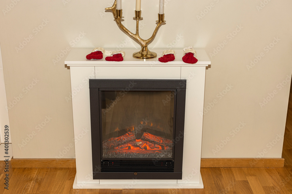 Close up view of electric fireplace isolated on white wall background.