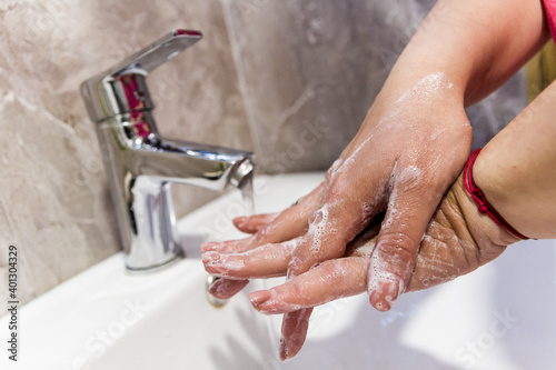 Washing hands in the bathroom. Hands washing, virus-free, bacteria-free. Hands hygiene with the water.