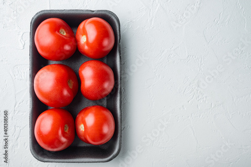 Red tomatoe, on white background with copy space for text