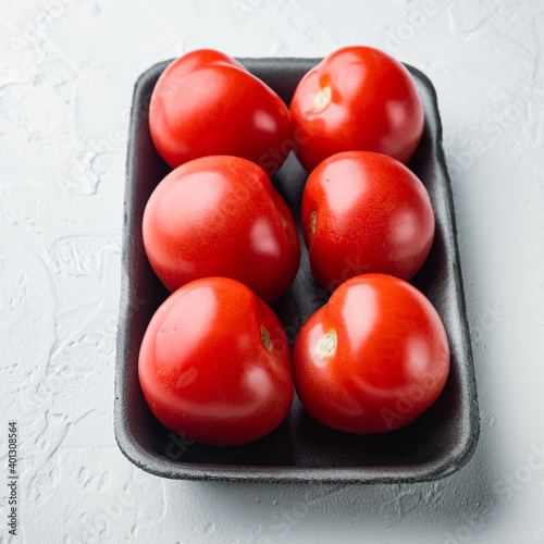 Red ripe tomatoe, on white background