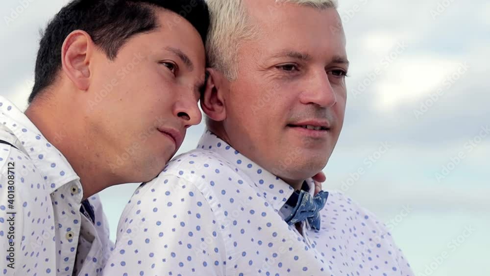 Close up video of two man in love. Gay couple spend time in nature Close up video of two man in love. Gay couple spend time in nature