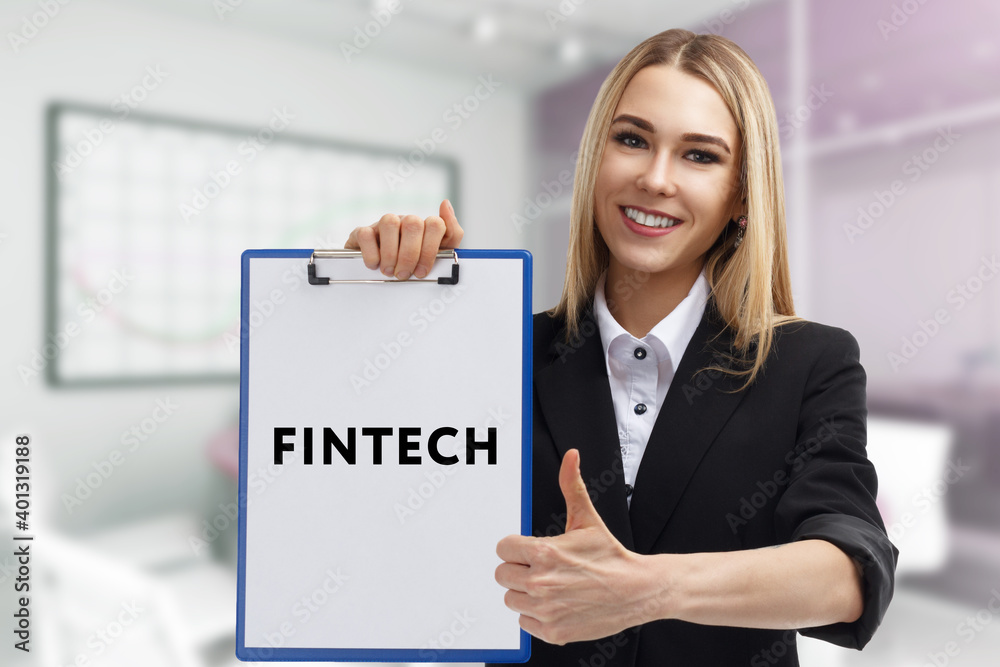 Business, technology, internet and network concept. Young businessman thinks over the steps for successful growth: Fintech Business, technology, internet and network concept. Young businessman thinks over the steps for successful growth: Fintech