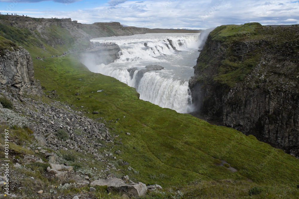 Visitors follow the Trail of Sigridur to an overlook above Gullfoss (Golden Falls) on the Hvita River in Iceland. Visitors follow the Trail of Sigridur to an overlook above Gullfoss (Golden Falls) on the Hvita River in Iceland.