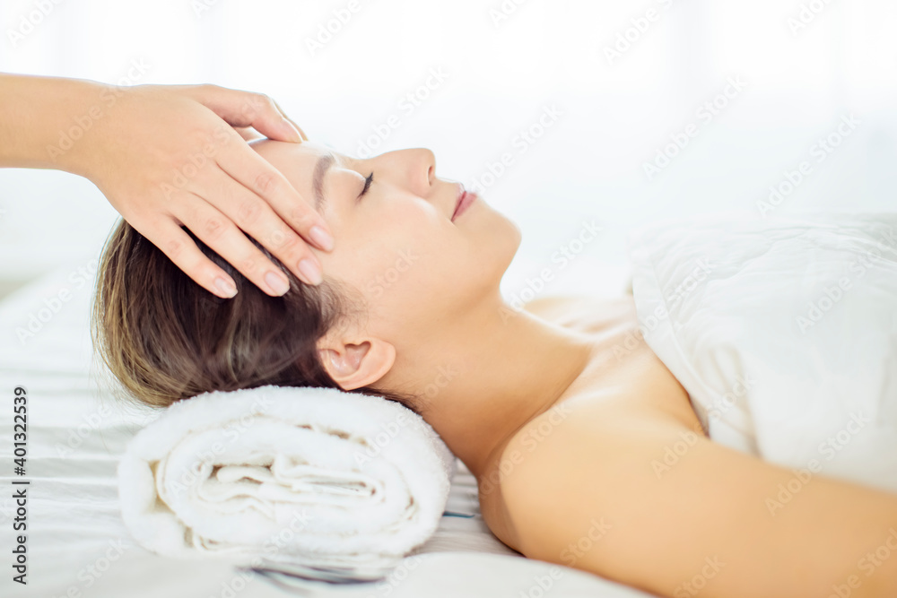 relaxed Young woman enjoy massage in spa salon relaxed Young woman enjoy massage in spa salon