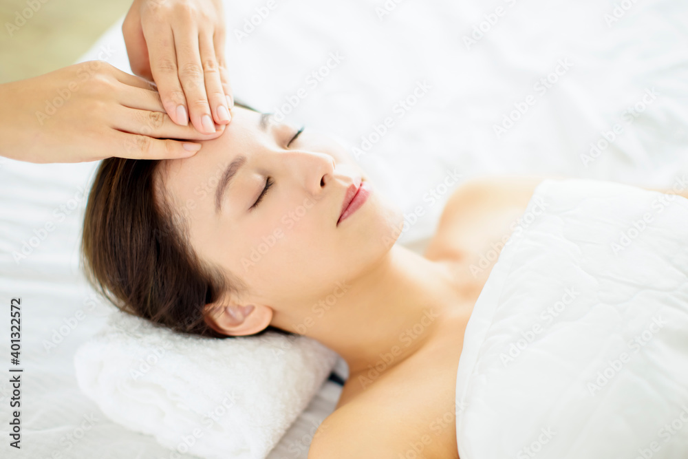 relaxed Young woman enjoy massage in spa salon relaxed Young woman enjoy massage in spa salon