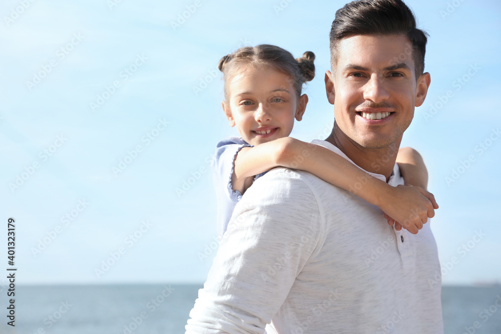 Father and daughter at beach. Family vacation Father and daughter at beach. Family vacation