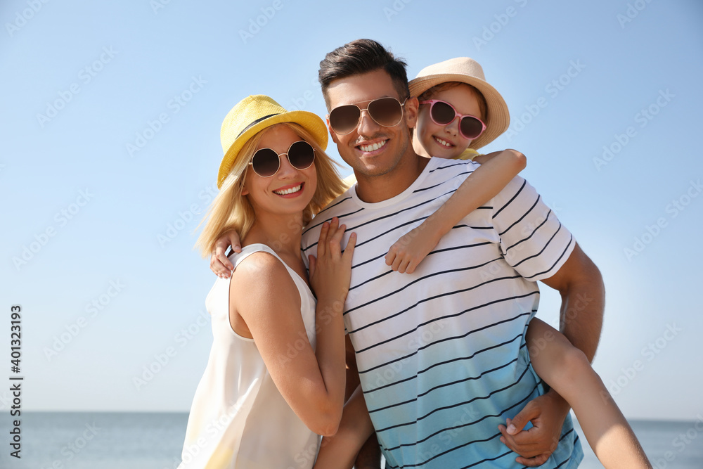 Happy family at beach on sunny summer day Happy family at beach on sunny summer day