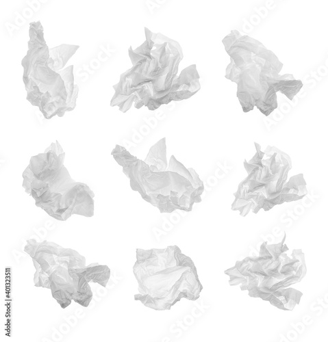 Set with used crumpled paper tissues on white background