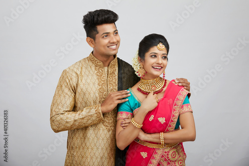 Photography Beautiful happy north Indian couple in traditional dress.