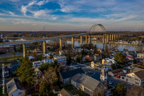 Aerial panorama of Chesapeake City Maryland historic fishing town on the Chesapeake Delaware canal with private boats docked in the marina and the Chesapeake City Bridge over the back creek photo