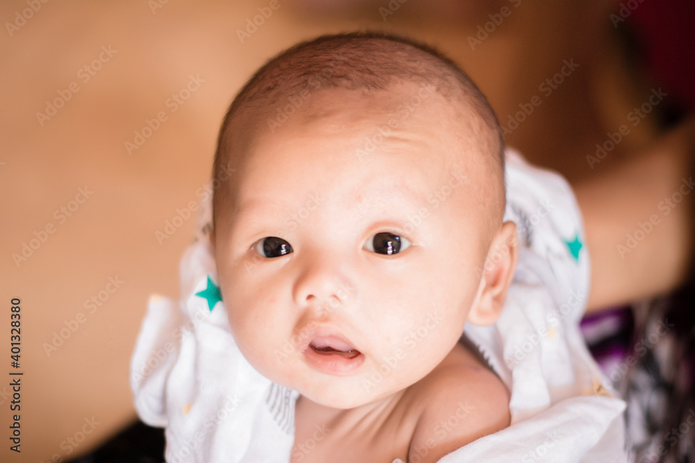Portrait of new born baby boy resting in mothers arms,family concept,cose up. Portrait of new born baby boy resting in mothers arms,family concept,cose up.