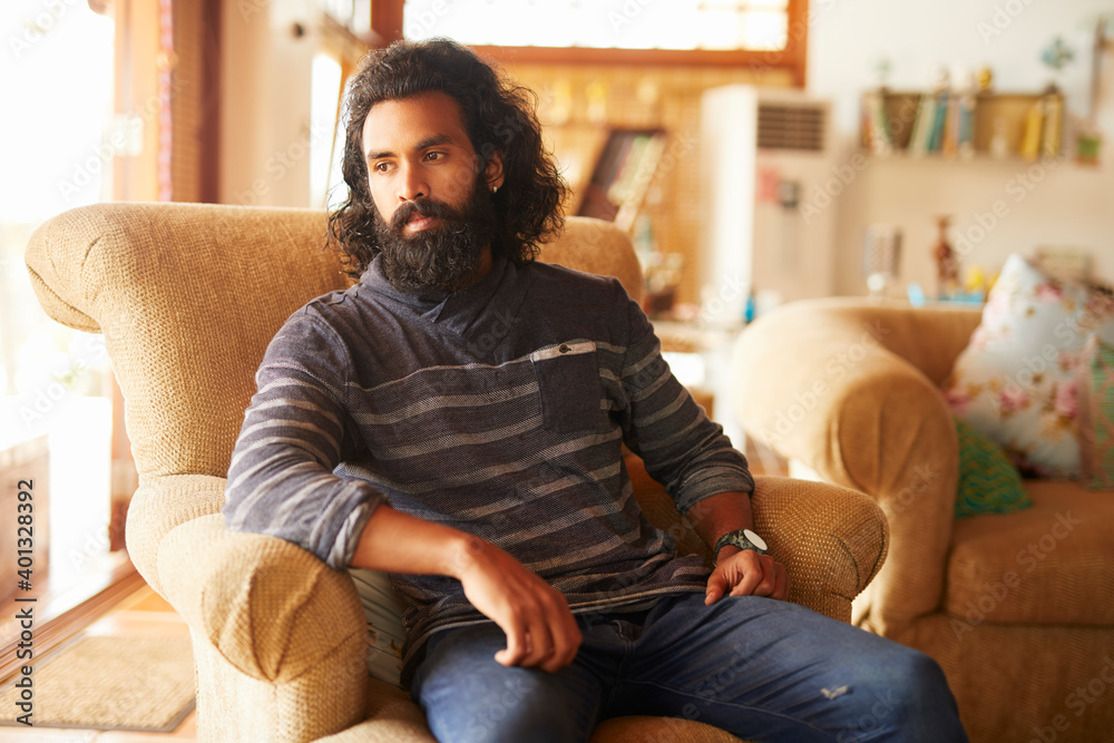 Obraz premium Long hair young man relaxing at home.