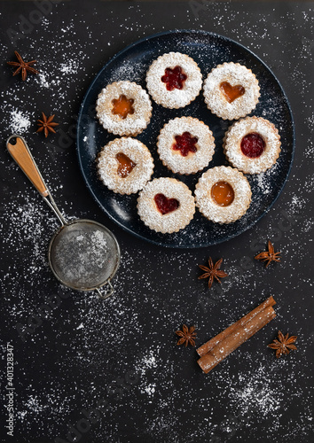 Christmas Linzer cookies on dark background. Top view. Flat lay.