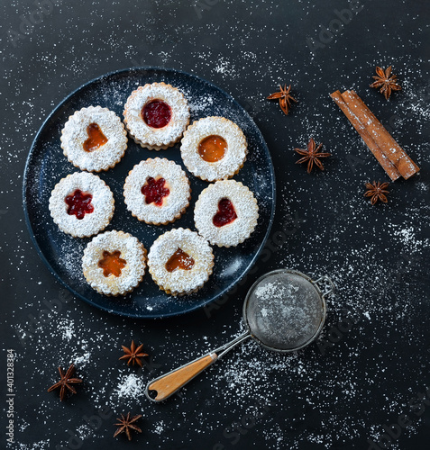 Christmas Linzer cookies on dark background. Top view. Flat lay.
