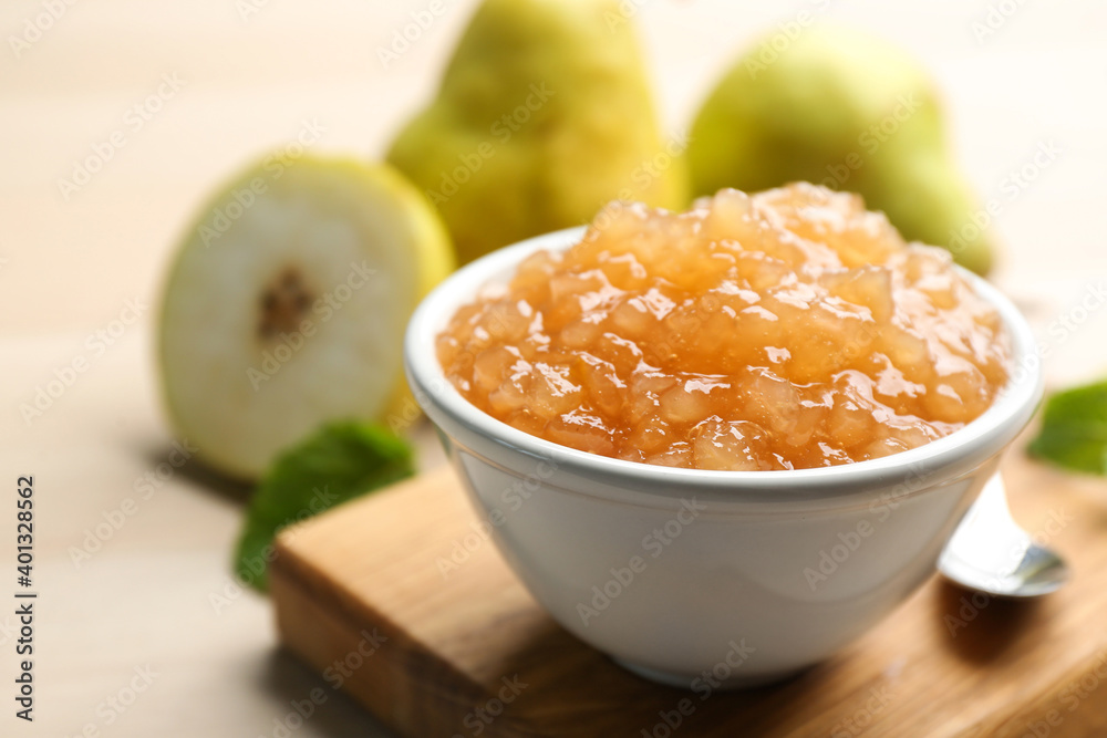 Tasty homemade pear jam and fresh fruits on wooden table, closeup Tasty homemade pear jam and fresh fruits on wooden table, closeup