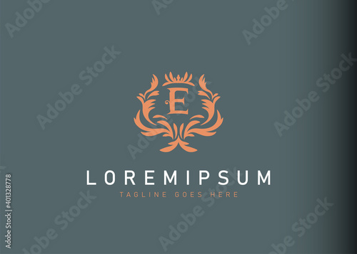 Heraldic initial letter E logo design. Vector illustration of elegant floral initial letter E icon design. Modern logo design with emblem style.