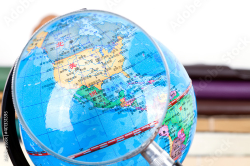 Use a magnifying glass to observe the continental United States on the globe