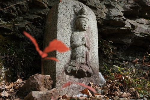 峠のお地蔵様。Old Trail with historical Stone Statue of Buddha. Trekking at mountain area, Japan.  photo