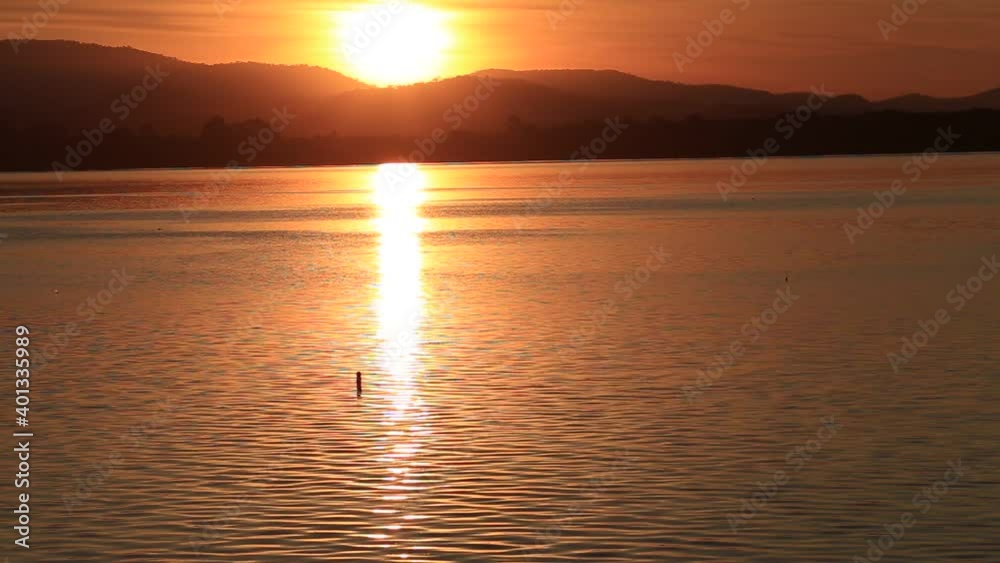 Blur nature video background The wind blows cool in winter and the view of the water in the natural reservoir with beautiful morning light. Blur nature video background The wind blows cool in winter and the view of the water in the natural reservoir with beautiful morning light.