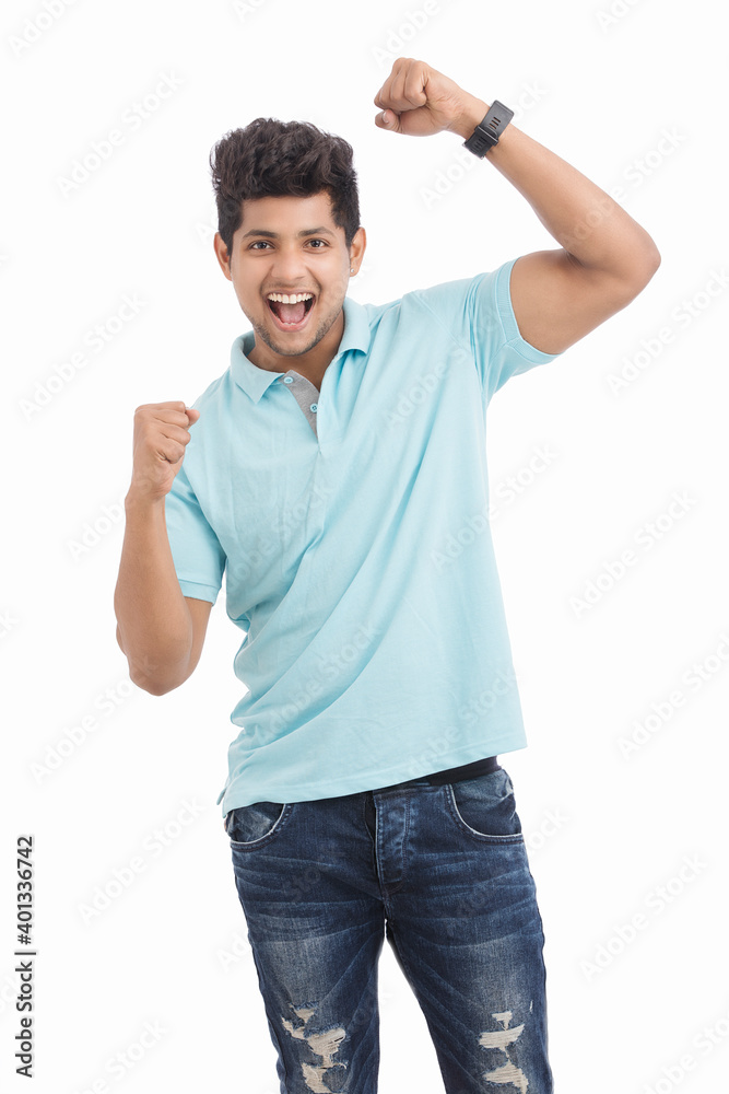 Cheerful Indian young man cheering after won isolated on white. Cheerful Indian young man cheering after won isolated on white.