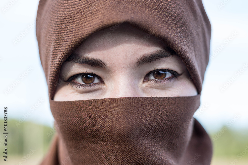 Portrait of an Arab woman in a hijab. A woman in a burqa. Portrait of an Arab woman in a hijab. A woman in a burqa.