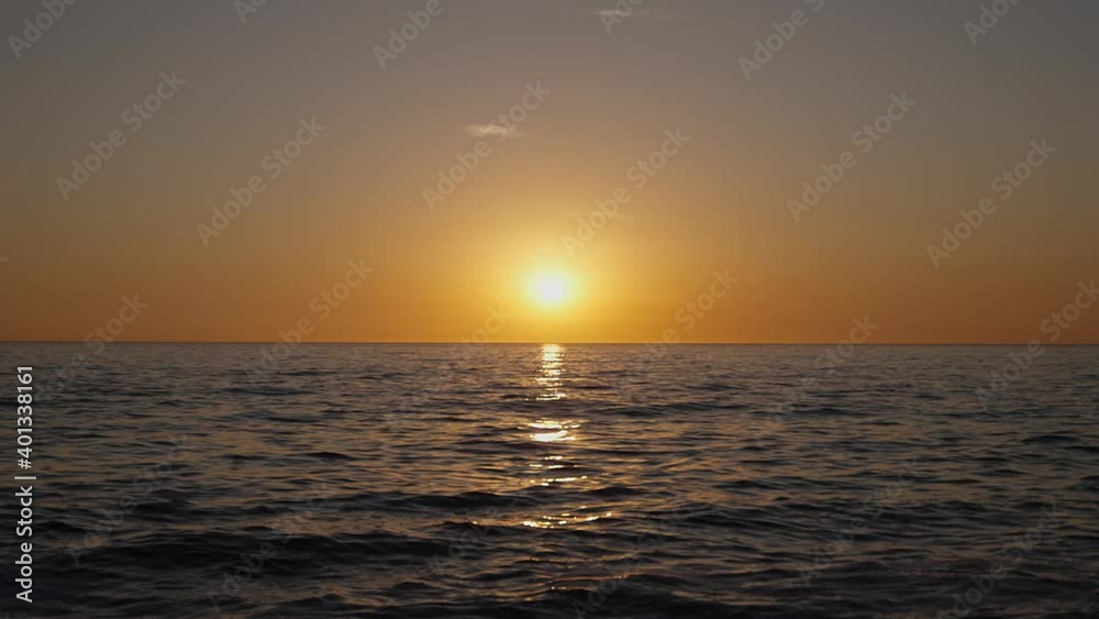Dramatic ocean sunset. Burning sky and shining golden waves. Sunset sea 4k. Red sky, yellow sun and amazing sea. Summer sunset seascape. Slow motion. Dramatic ocean sunset. Burning sky and shining golden waves. Sunset sea 4k. Red sky, yellow sun and amazing sea. Summer sunset seascape. Slow motion.