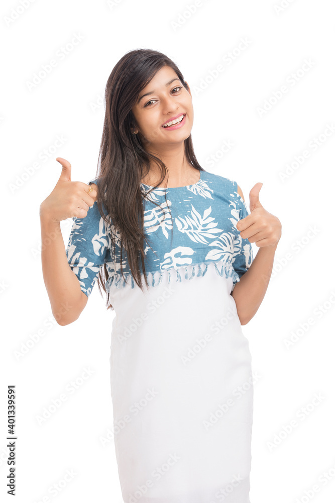 Attractive young women showing thumbs up on white. Attractive young women showing thumbs up on white.
