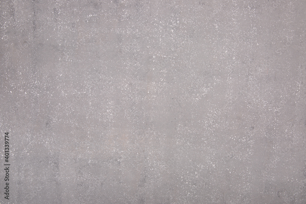 Gray background under concrete, wet asphalt.