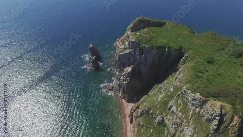 View from a drone of the coastline with a rocky coast island of Shkot photo