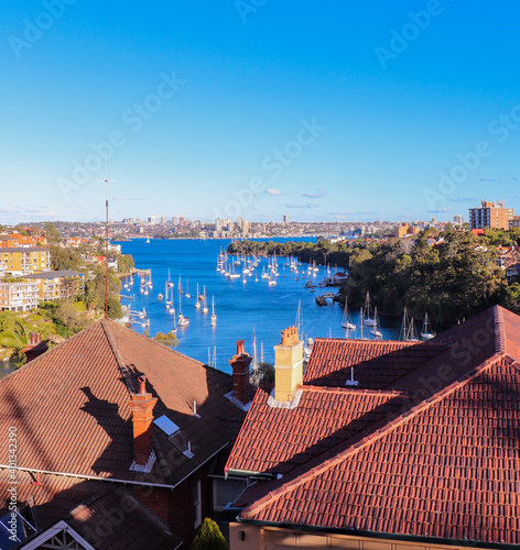 View of Mosman Bay, beyond roofs. Mosman Bay is surrounded by Mosman, Cremorne & Neutral Bay in Sydney, Australia