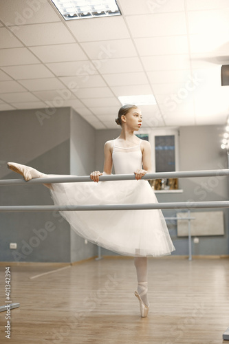 Gorgeous ballet dancer. Ballerina in pointe. Girl on a white background.