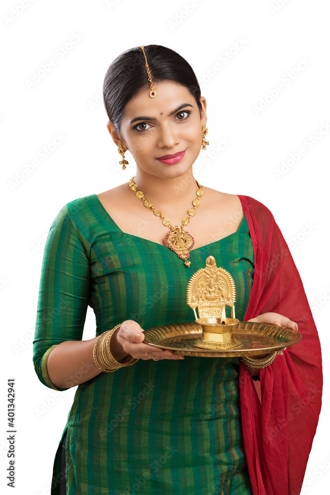 Hindu Indian young women holding Deepam in hands. ( Kamatchi vilakku ) Hindu Indian young women holding Deepam in hands. ( Kamatchi vilakku )