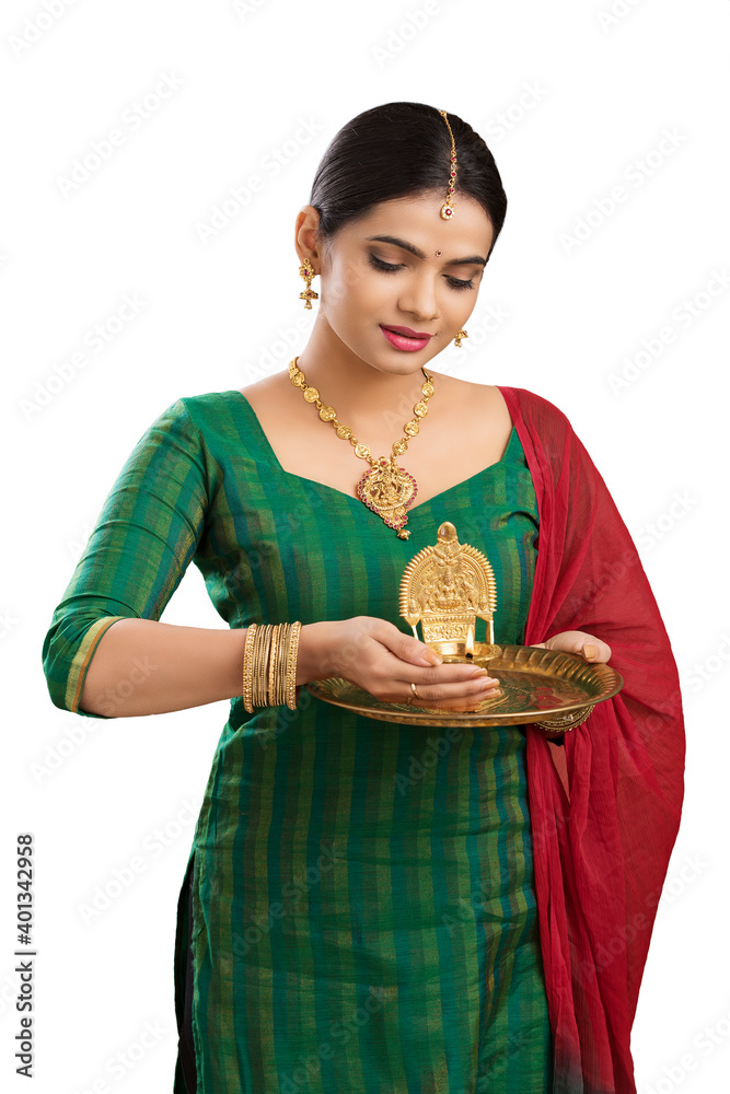 Hindu Indian young women holding Deepam in hands. ( Kamatchi vilakku ) Hindu Indian young women holding Deepam in hands. ( Kamatchi vilakku )